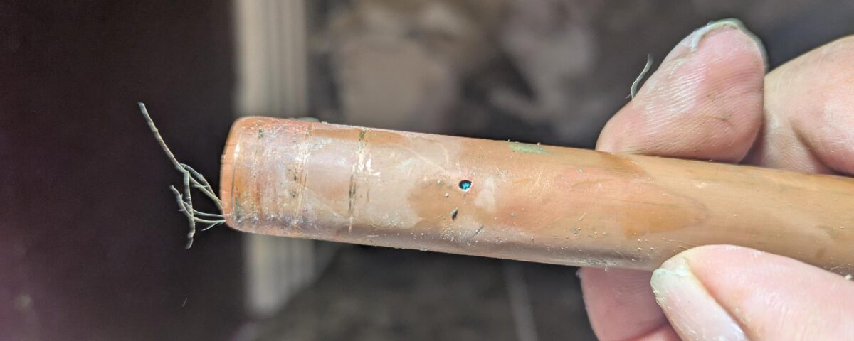 Pinhole defect identified in a concealed copper mains-water pipe