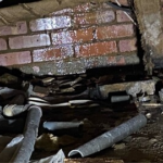 Saturated subfloor and concealed pipework exposed during leak detection in Little Chalfont
